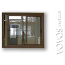 Συνθετικα pvc Κουφωματα,   Πορτα Επαλληλη Βαρεου Τυπου  σε απομιμηση  ξυλου Καρυδιας στην Πειραικη Πειραιας